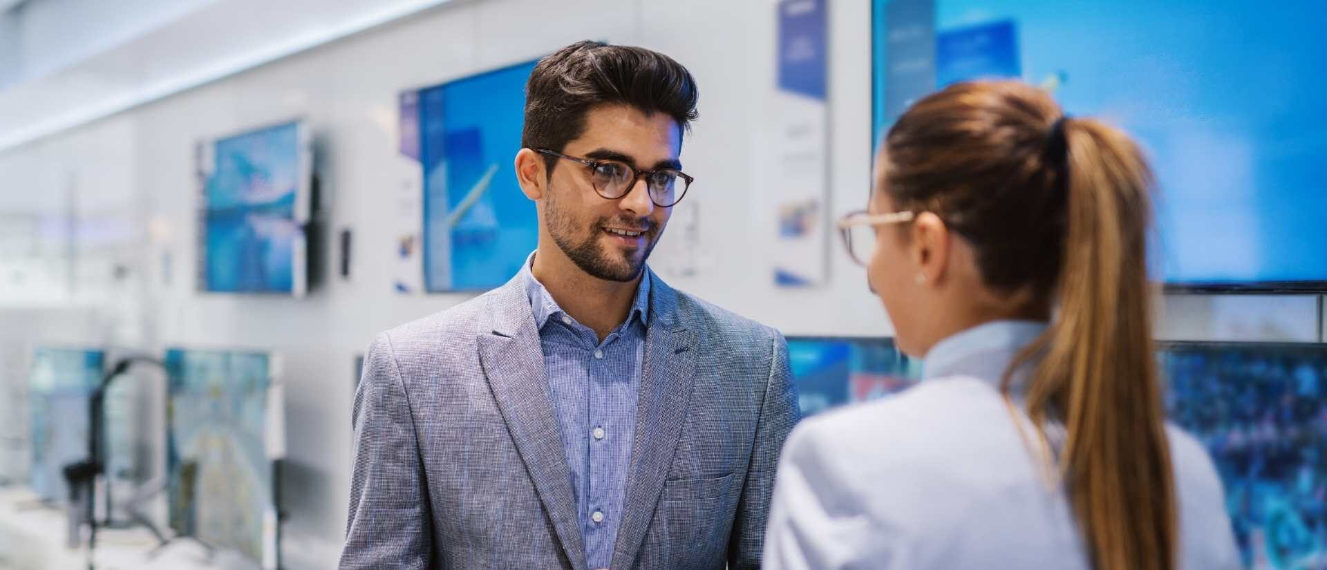 tech retail shop with two people talking