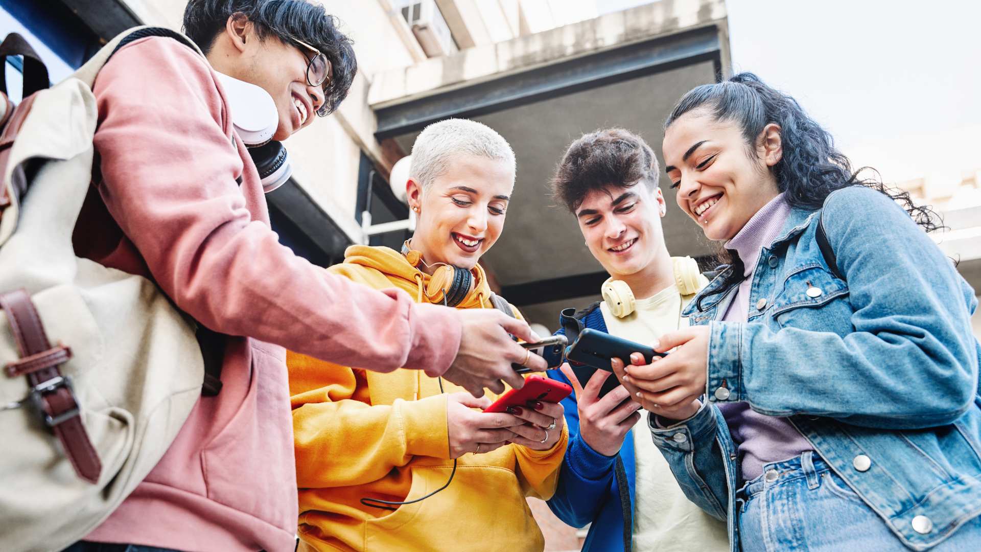 University students looking at phones