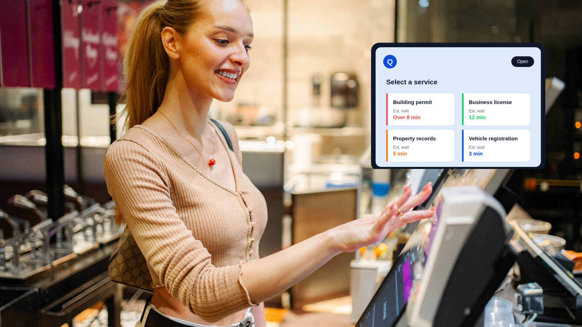 screenshot of lady operating a queue management screen with the pop up image of the screen display in the top right corner of the image